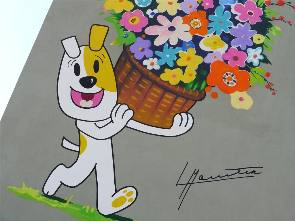 Pies Reksio zdobi jeden z bloków w Suwałkach - w mieście powstał kolejny mural